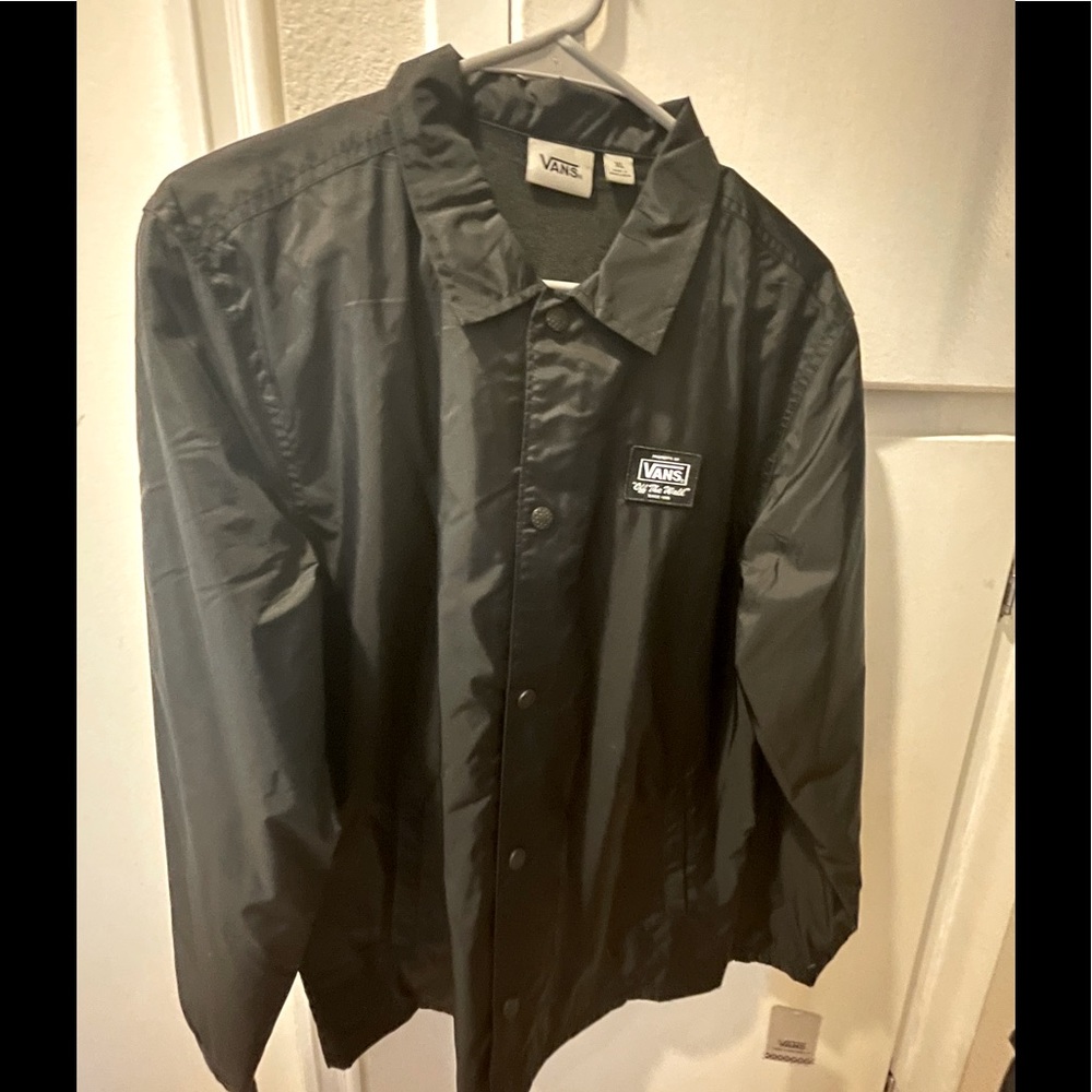Youth Vans brand windbreaker type jacket with thicker lining for added warmth.